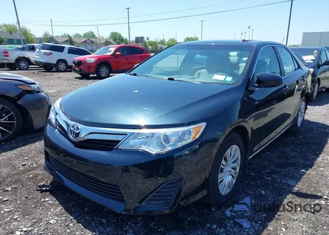 2014 Toyota Camry Le z USA, uszkodzony, nr VIN 4T4BF1FK3ER409973